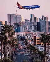 Plane over city